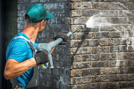 How does hiring a professional for building washing help you